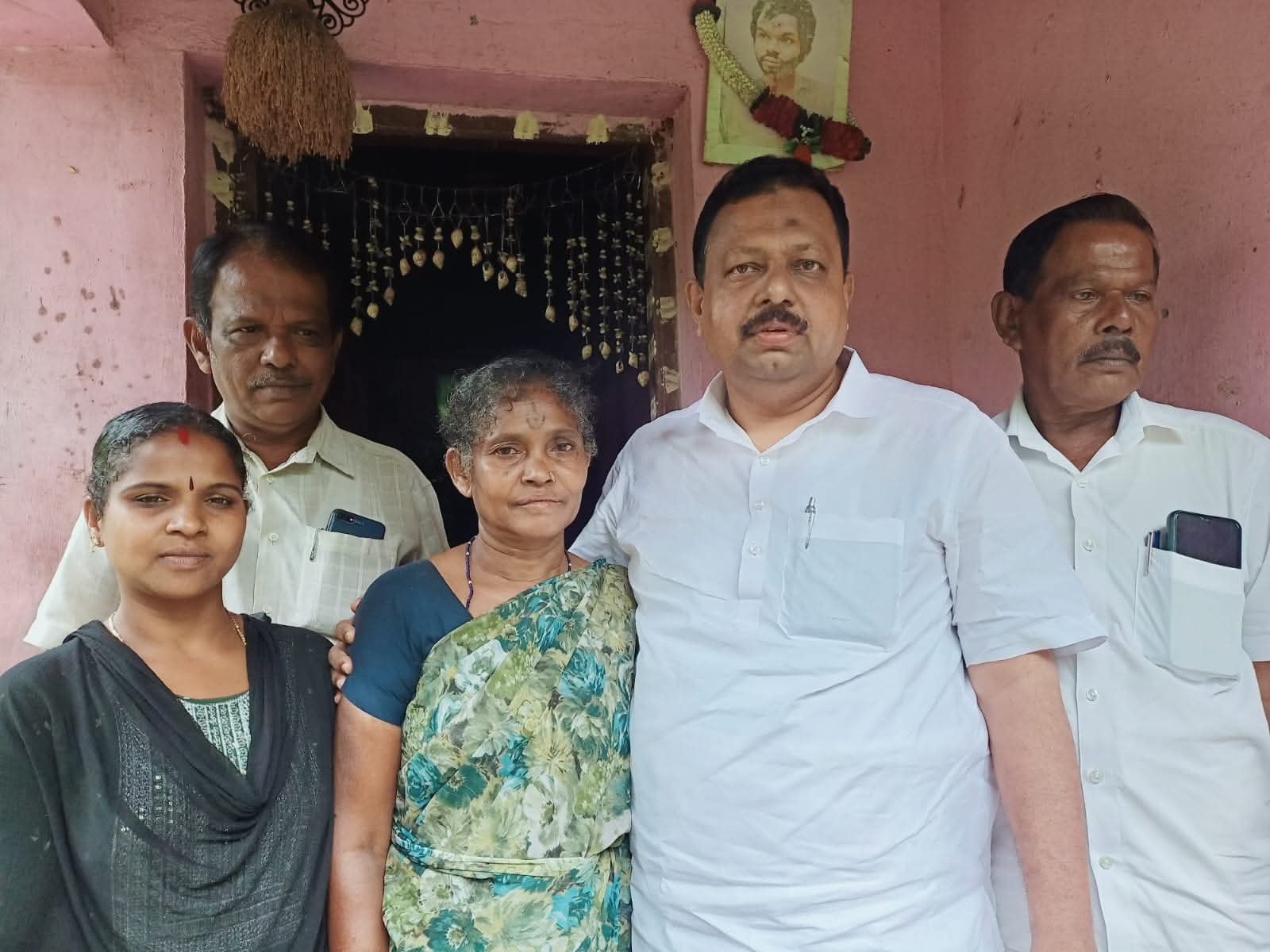 Saleem Madavoor with a family at their home