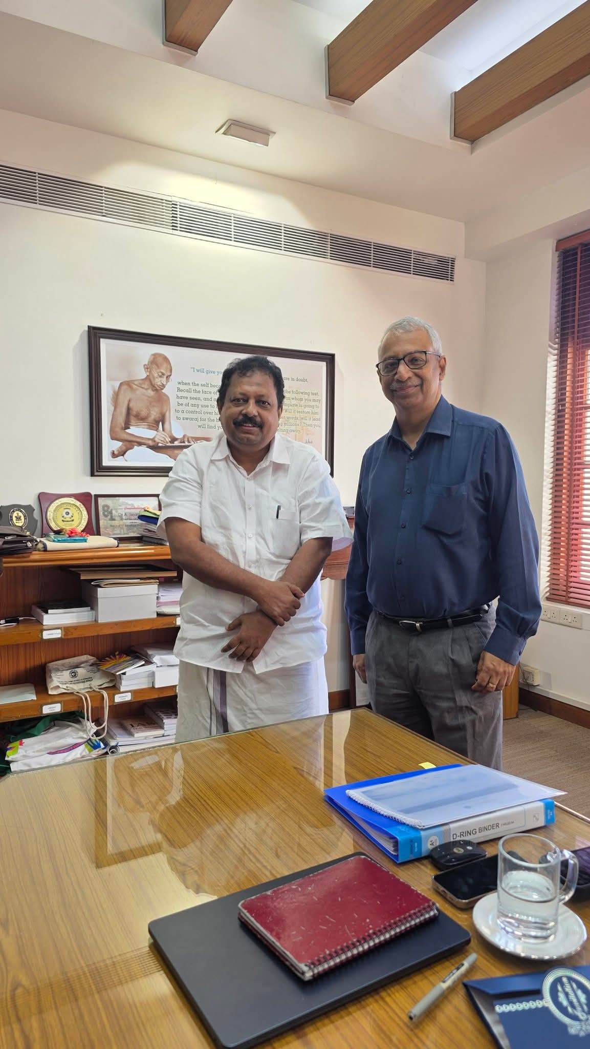Saleem Madavoor meeting an official