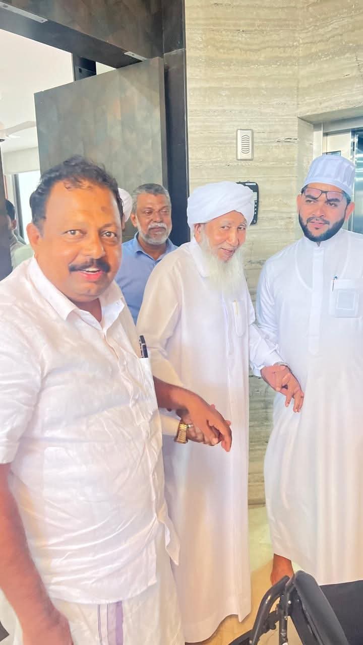 Saleem Madavoor with an Islamic scholar